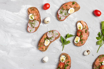 Quail eggs, radish, snacks with parsley and dill
