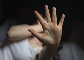 Obraz premium Girl raised her hand for stop violence against women.