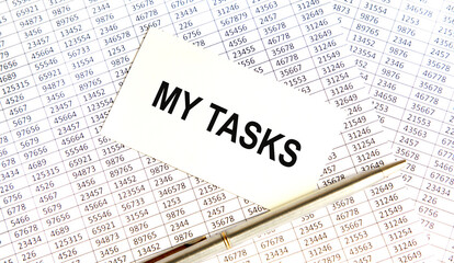 Obraz premium Business concept. Notebook with text MY TASKS sheet of white paper for notes, calculator, glasses, pencil, pen, in the white background