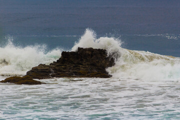 Fototapeta na wymiar Rock in middle of sea.
