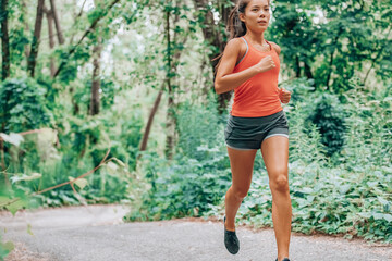 Athlete running training cardio outdoors jogging in city park running outside for healthy active...