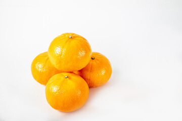 Healthy raw orange fruits background. Orange fruits on white background.