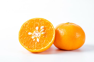 Orange fruits with basket on white background.