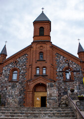 Fototapeta na wymiar Gothic Church of the Virgin Mary made of stone and brick in the city of Braslav, Belarus
