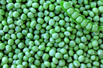 Green peas background. Organic food. Peeled green peas.