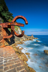 Fototapeta premium San Sebastian Ondarreta beach, La Concha bay.Cantabrian Sea, Basque Country, Spain, Euskadi, sculpture 