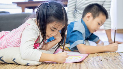 Happy family young mother child with homework.