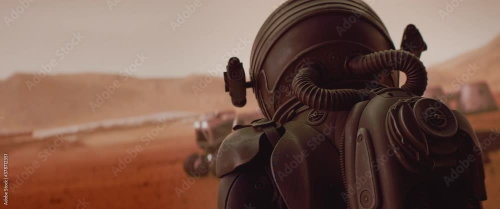 Wall mural handheld tracking back view of astronaut wearing space suit walking on a surface of a red planet. ma