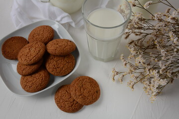 Chocolate chip cookies  with milk on white background