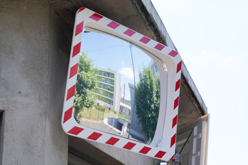 convex mirror for help street traffic in road on safety concept in city center