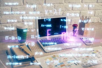 Desktop computer background and formula hologram writing. Double exposure. Education concept.