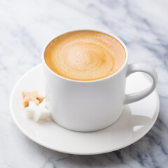 Coffee, espresso in white cup. Marble background. Close up.