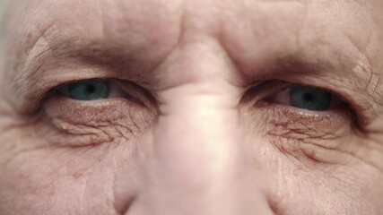 Face and eyes of mature person. Close up of large wrinkles on the face of senior male. Portrait of attractive elderly man. Doctor man face. - Powered by Adobe