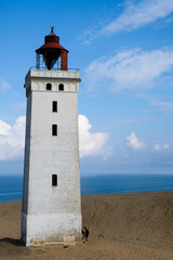 Fototapeta premium Famous Rubjerg Knude Fyr on the Dune Cliff of the northern Jutland, Denmark, Europe