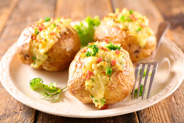 baked potato with cheese, cream and bacon