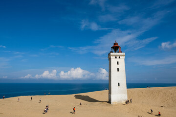 Fototapeta premium Famous Rubjerg Knude Fyr on the Dune Cliff of the northern Jutland, Denmark, Europe