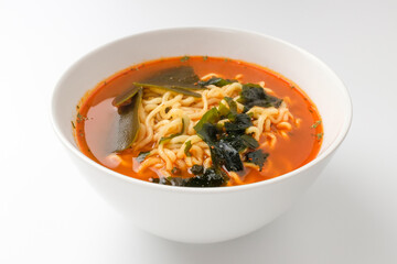 Spicy ramen on white background