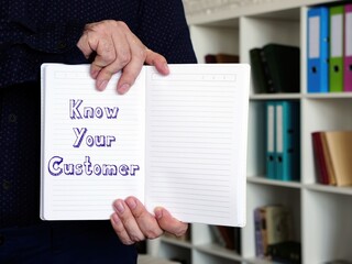 Financial concept meaning Know Your Customer with sign on the piece of paper.
