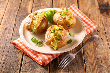 baked potato with cheese, cream, bacon and broccoli