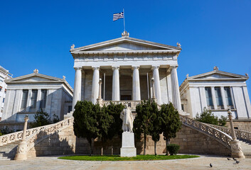 Obraz premium Facade of the 'National Library of Greece' with Greek flag flying, architect Freiherr von Hansen