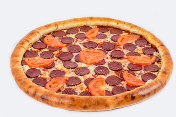 Pepperoni pizza shot on a white plate under the tenderloin