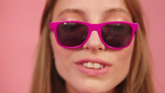 Girl On Pink Glasses Pout And Send Kiss On The Camera. - close up shot