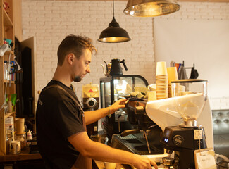 Fototapeta na wymiar Barista preparing coffee at cafe.