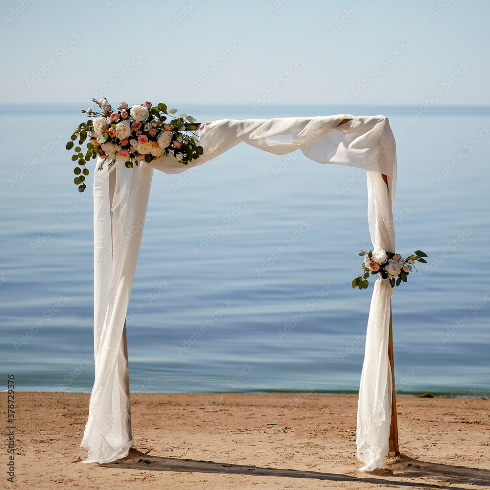 Wall mural flower arch on the lake shore. background for wedding invitations.