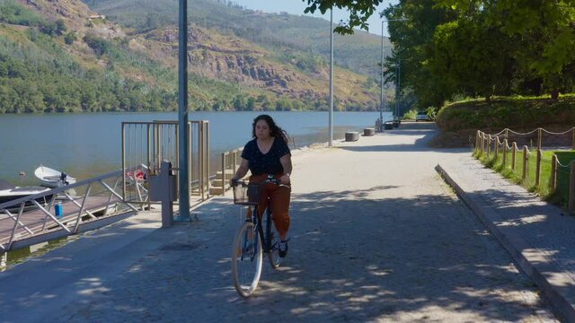 Calmly Riding A Bike Close To The Douro River