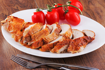 delicious grilled chicken with beautiful tomatoes on a green branch