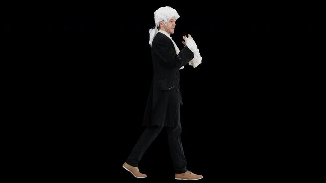 Man dressed as courtier talking expressively and waiving his hands while walking and looking at camera, Alpha Channel