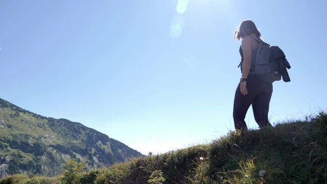 Free spirited woman trekking at Amden, Switzerland 