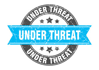 Fototapeta premium under threat round stamp with ribbon. label sign