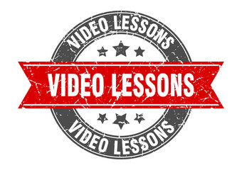 Obraz premium video lessons round stamp with ribbon. label sign