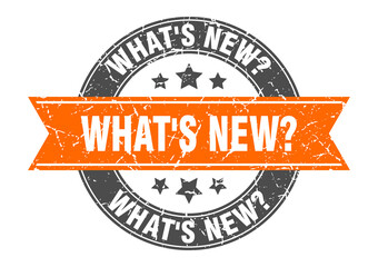 what's new? round stamp with ribbon. label sign