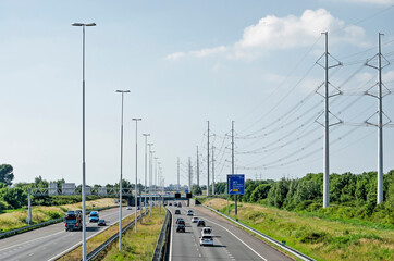 Delft, The Netherlands, June 13, 2020: view from a viaduct on the A4 motorway towards Rijswijk and The Hague on a sunny day in early summer