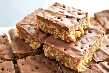 Chocolate rice crispy cake on white. Copy space is on the left side. 