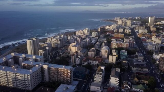 High Rise Residential and Hotels sit tall, close to the ocean during a late evening, sea point, cape town, SA Drone Aerial
