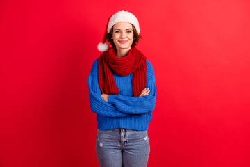 Photo of positive cheerful girl in santa claus hat cross hands enjoy christmas advent party day...