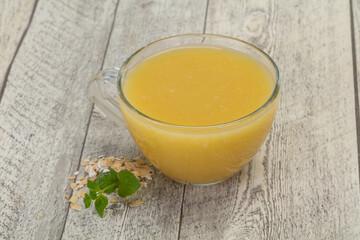 Dietary vegetarian oats milk over wooden