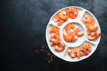 Fototapeta na wymiar shrimp ready to eat boiled or fried seafood prawn without shell on the table serving top view copy space for text keto or paleo diet pescetarian food background rustic