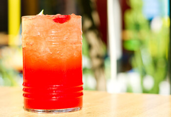 A glass of fruit strawberry cocktail with copyspace for a text