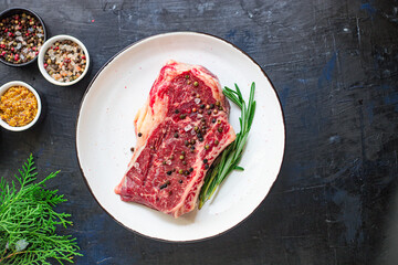 fresh raw steak rib eye meat beef juicy on the table serving size top view copy space for text food background rustic
