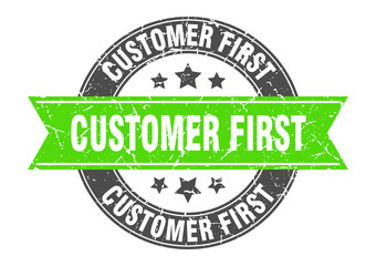 Obraz premium customer first round stamp with ribbon. label sign