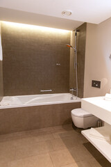 Modern bathroom interior with illuminated mirrors