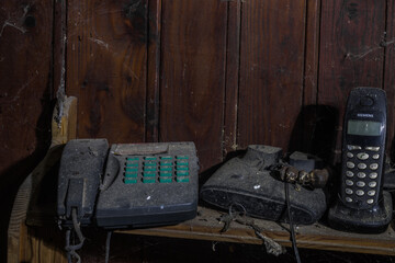 old phones on a table of a old house