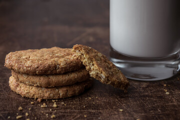 Close-up of a glass of milk and rustic homemade cookies