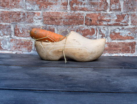 A wooden shoe with hay for the Dutch fest of Sinterklaas. Room for text. 