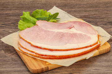 Sliced pork belly over board