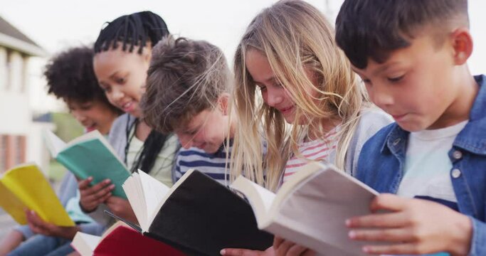 Group of kids reading books